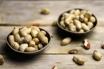 Peanuts in a peel in a bowl. Selective focus. Macro.