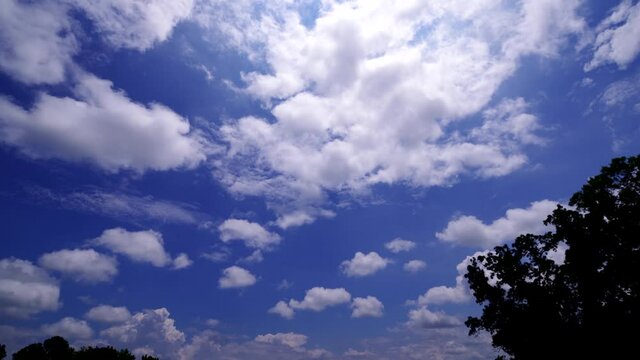 White clouds rolling through blue skies, timelapse