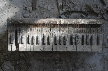 Old dirty toy piano in kindergarten of ghost town Pripyat