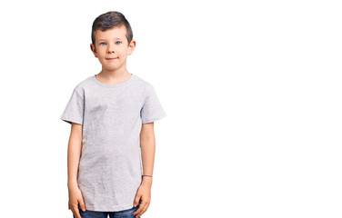 Fototapeta premium Cute blond kid wearing casual clothes with serious expression on face. simple and natural looking at the camera.