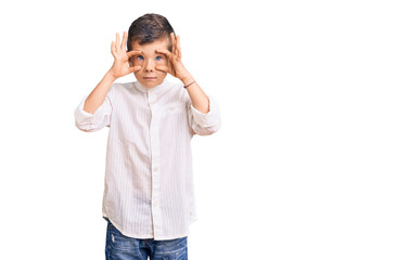 Cute blond kid wearing elegant shirt trying to open eyes with fingers, sleepy and tired for morning fatigue