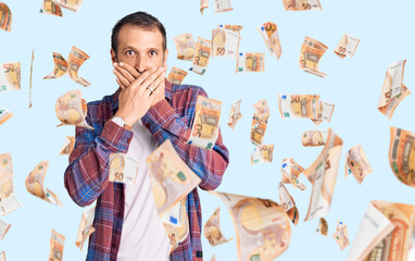 Young handsome man wearing casual clothes shocked covering mouth with hands for mistake. secret...