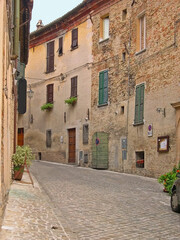 Italy, Marche, Corinaldo, typical city medieval street. The place is warm and attractive. - 382927848