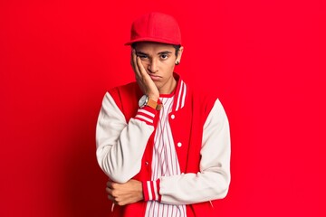 Young african amercian man wearing baseball uniform thinking looking tired and bored with depression problems with crossed arms.