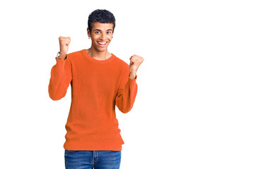 Young african amercian man wearing casual clothes screaming proud, celebrating victory and success very excited with raised arms