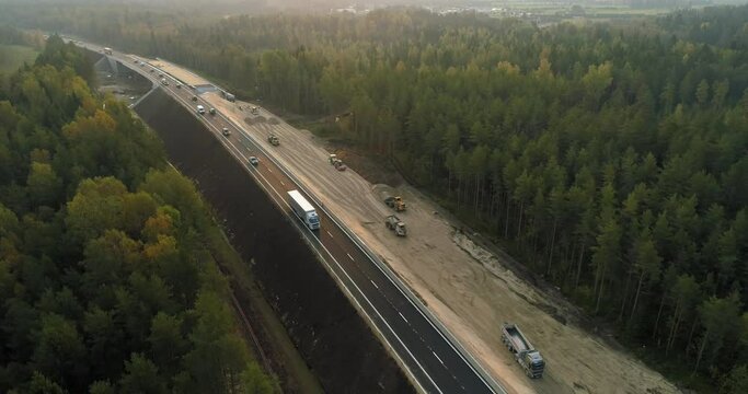 Road construction site building a new highway aerial view