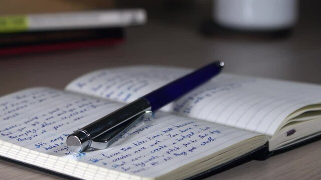 Notebook with pages of handwritten notes