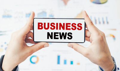 Business News concept on smartphone in hands