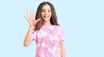Fototapeta na wymiar Cute hispanic child girl wearing casual clothes showing and pointing up with fingers number five while smiling confident and happy.