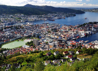 Fototapeta na wymiar Spectacular View From Mount Floyen To Downtown And The Harbour Of Bergen On A Sunny Summer Day With A Clear Blue Sky And A Few Clouds