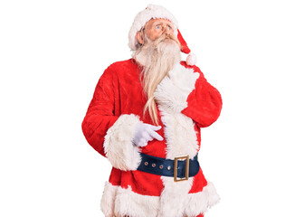 Old senior man with grey hair and long beard wearing traditional santa claus costume touching painful neck, sore throat for flu, clod and infection