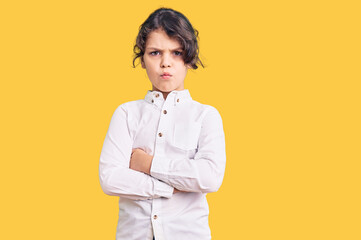 Cute hispanic child wearing casual clothes skeptic and nervous, disapproving expression on face...