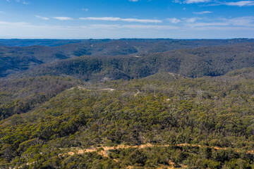 Aerial view of a dirt track running through forest in regional New South Wales in Australia