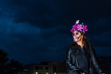 portrait of woman wearing a Dia de muertos makeup