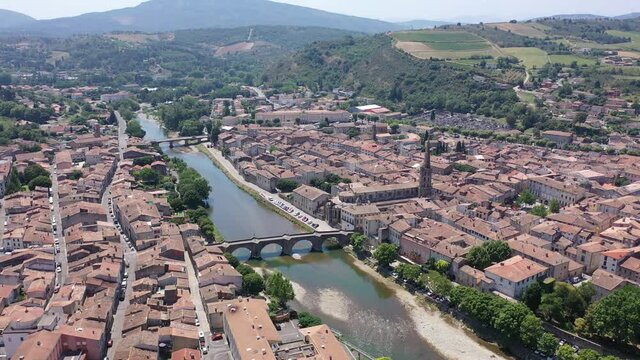 Aerial view of houses of Limoux old town and river Aude at sunny summer day, France