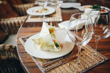 salad on a white round plate close - up on the table.