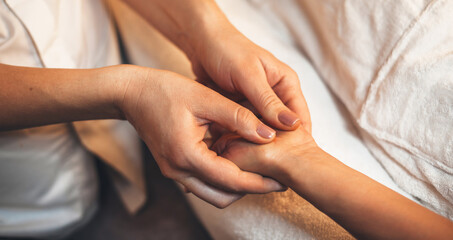 Fototapeta na wymiar Upper view photo of a hand massage procedure done at a professional spa salon