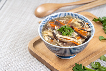 Taiwanese food - Homemade delicious Hot and Sour Soup in a bowl on a serving tray.