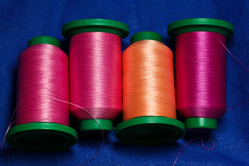 bobbins of polyester thread for embroidery.