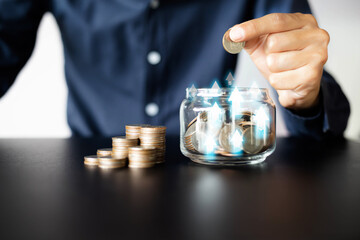businessman holding coins putting in glass,business development to success and growing growth concept