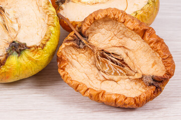 Old moldy apple, unhealthy and disgusting fruit