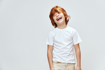 Cheerful boy laughing with mouth wide open white t-shirt cropped  © SHOTPRIME STUDIO