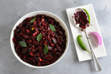 Beetroot curry stir fry, Kerala style organic beetroot Thoran curry recipe on white background....