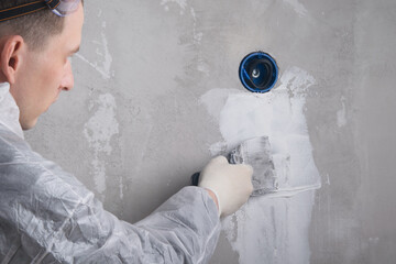 worker, seal up the internal wiring of the outlet with putty