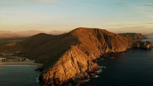 Establishing shot of a beautiful mountain at sunset.