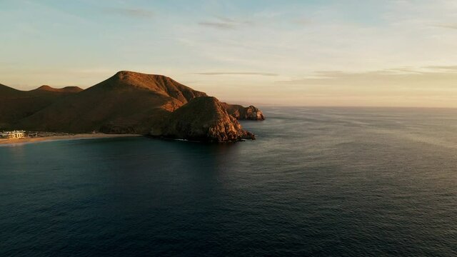 Establishing shot of a beautiful mountain at sunset.