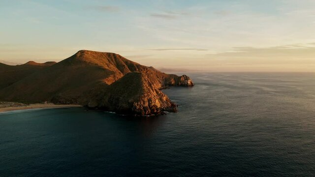 Establishing shot of a beautiful mountain at sunset.