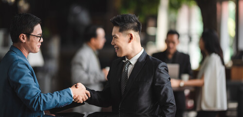 Group of sucessful business person and coworker hand shaking with smile and happy for new start up project at the office conference meeting room