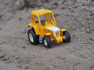 Children's toy tractor. Agricultural machinery.