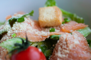 Fresh salmon salad light meal for healthy, Vegetables and red tomato cheese and crispy bread in white bolw.