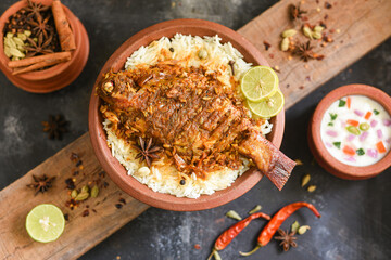 Fish biryani. Spicy Indian Malabar biryani or Hydrabadi biryani, Dum Biriyani,  fish and rice....