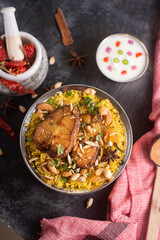 Fish biryani. Spicy Indian Malabar biryani or Hydrabadi biryani, Dum Biriyani,  fish and rice. pulao basmati rice, spicy mixed rice dish with meat curry for Ramadan Kareem, Eid