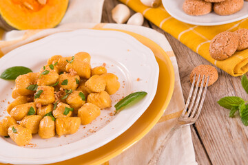 Pumpkin gnocchi with grated amaretti cookies.