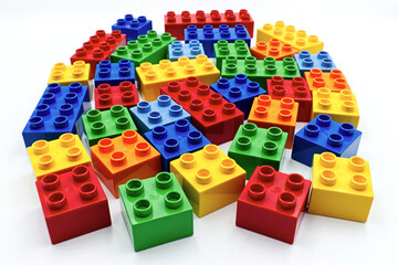 Obraz premium Colored plastic building blocks isolated on white background