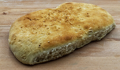 Ciabatta , italian bread, on wooden background