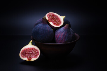 Tasty figs on a black background. Top view.