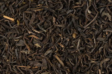 Dried tea leaves background texture. close-up
