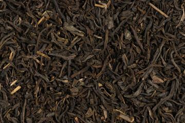 Dried tea leaves background texture. close-up