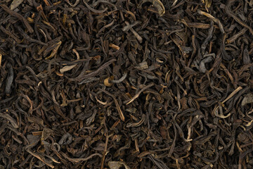 Dried tea leaves background texture. close-up