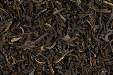 Dried tea leaves background texture. close-up
