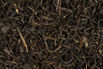 Dried tea leaves background texture. close-up