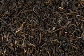 Dried tea leaves background texture. close-up