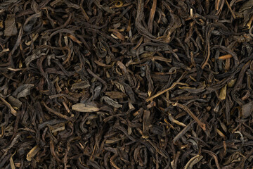 Dried tea leaves background texture. close-up