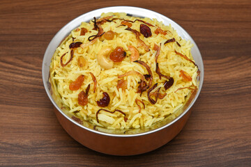 Veg biryani. Spicy Indian Malabar biryani or Hydrabadi biryani, Dum Biriyani,  pulao, pulav, pilaf, basmati rice, spicy mixed rice dish with meat curry for Ramadan Kareem, Eid