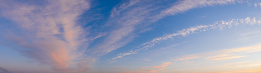 Colorful sky with cirrus clouds during dawn. High resolution panorama. View from drone