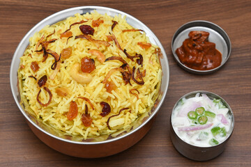 Veg biryani. Spicy Indian Malabar biryani or Hydrabadi biryani, Dum Biriyani,  pulao, pulav, pilaf, basmati rice, spicy mixed rice dish with meat curry for Ramadan Kareem, Eid